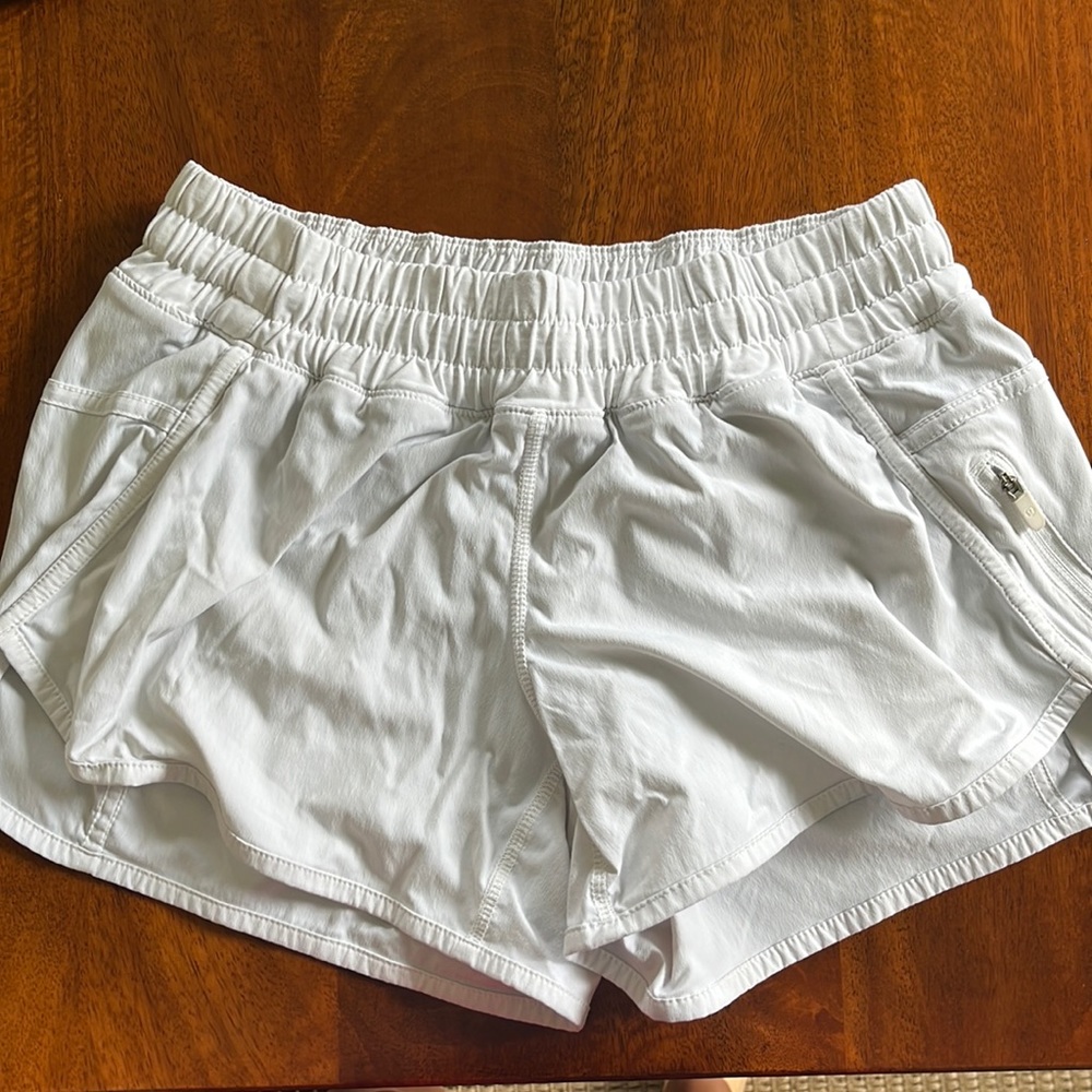 White tracker Lululemon shorts